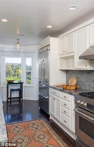 Cook's choice: The kitchen includes stainless steel appliances and country-style cabinets